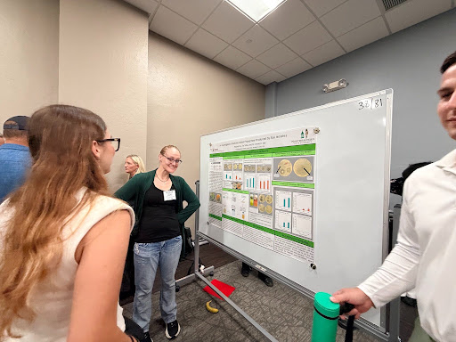 Rachel Fox at the annual OK-INBRE conference with her poster. 