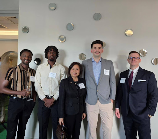 Jacob Sears, Jason Finley, Dr. Julia Kwok, Joshua Adeyemi, and Kamau Kibinge at the CFA Society Oklahoma Dinner. 