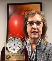 Dr. Cindi Fries holding award