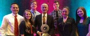 Dr. Salmon holding his award, surrounded by students (left to right) Kevin Tomasu, Kristen Harris, Connor Gallentine, Danny Blanco, Krystal Rogge and Sarah Stueder