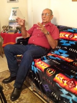 Raymond Tongkeamha talking on couch in living room