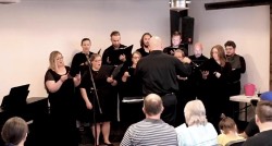 Vox Solaris Chamber Choir singing in front of audience