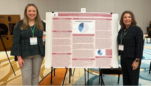 Lauren York and Karen Carey beside presentation poster