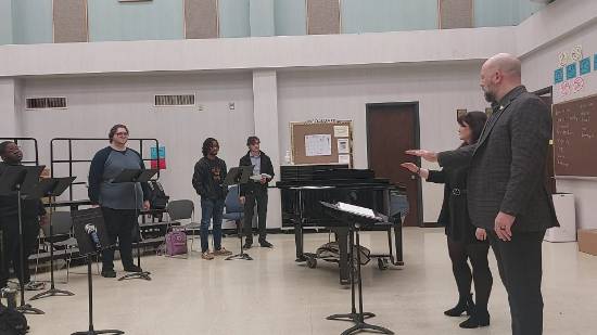 Dr. Jeffery Wall directing students in choir