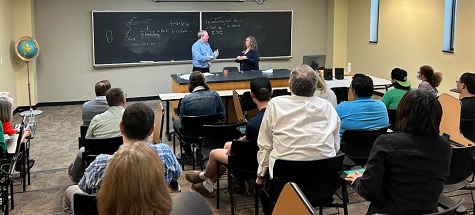 Dr. Jim Coykendall accepts a recognition plaque following his L. P. Woods Endowed Lecture for Mathematics in Tahlequah on April 12, 2023.   