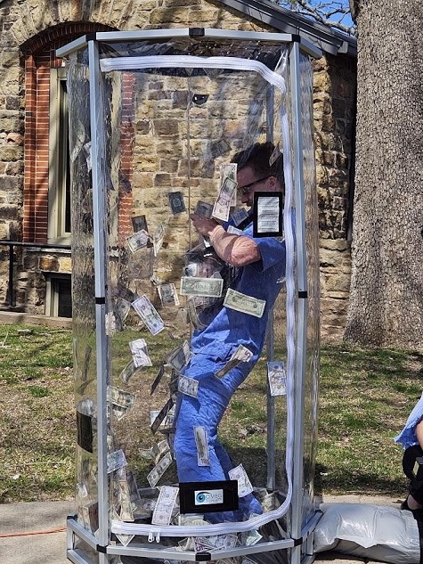4th year student, Jacob Musto, in the Cash Cube