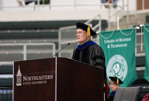 Dr. Mike Chanslor speaking to students at the College of Liberal Arts graduation ceremony