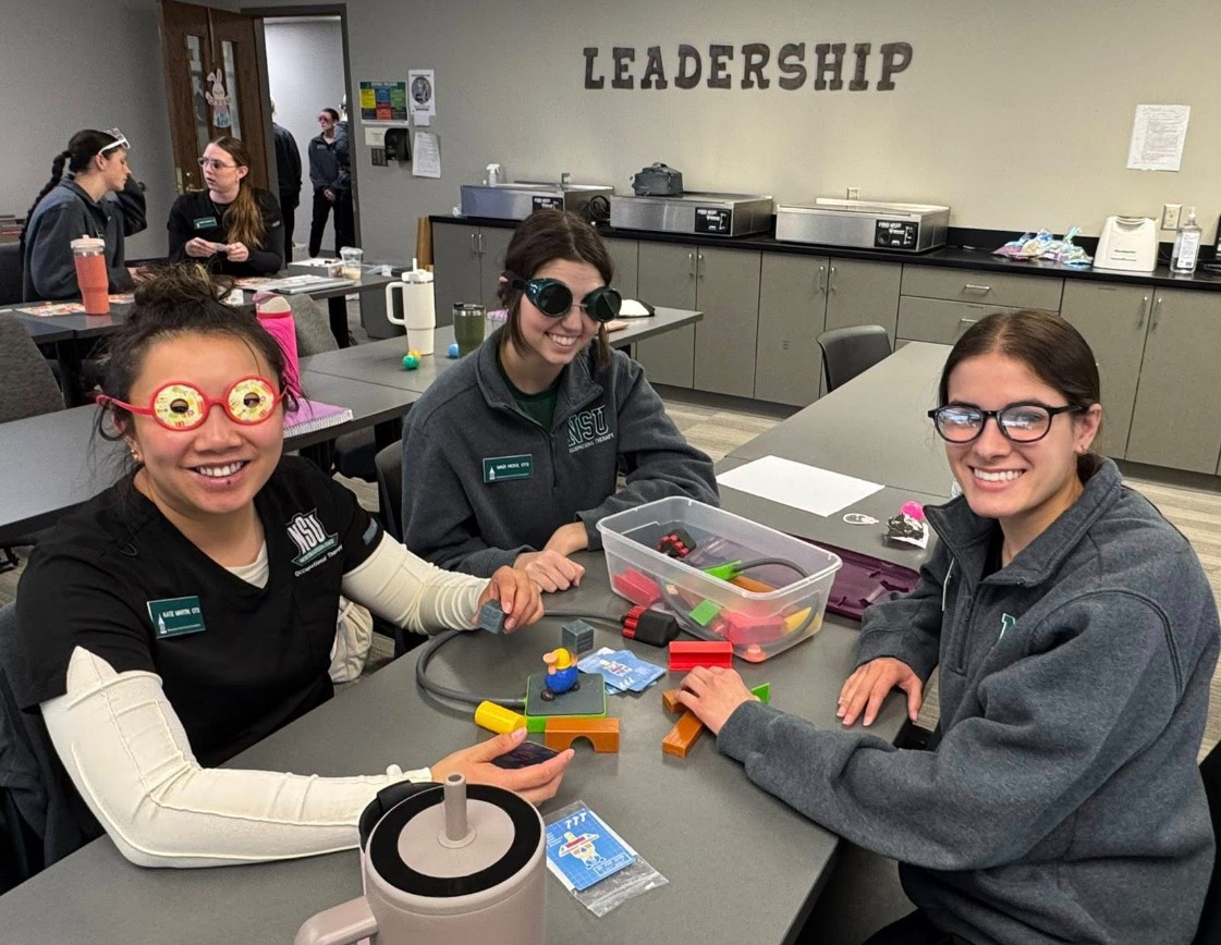 OT students practicing low vision assessments with Alumni Tara Ottenbacher OT students practicing low vision assessments with Alumni Tara Ottenbacher