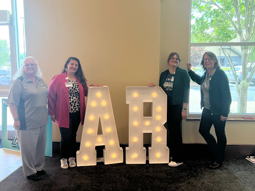 The picture includes the Dr. Sallie Ruskoski, Cherika Roberts (president of the ASCLS AR), Amber Reed (a graduate from NSU MLS and laboratorian at St Anthony), and Dianne Kirk.