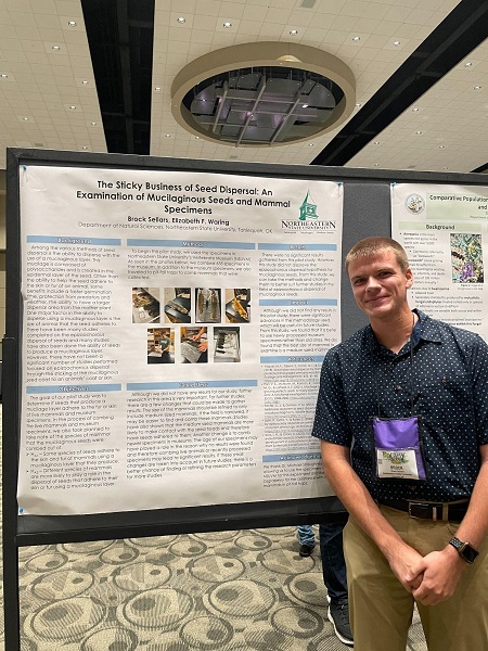 Brock Sellars with his poster titled "The Sticky Business of Seed Dispersal: An Examination of Mucilaginous Seeds and Mammal Specimens" at the International Botany conference.