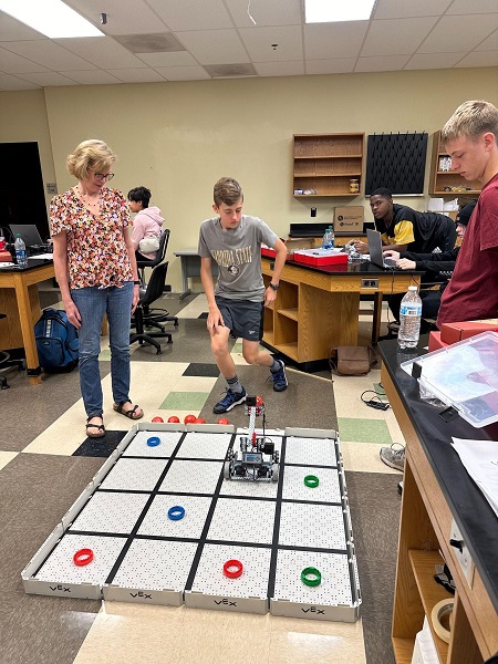 Dr. Pamela Christol with participants in the Robotics for Young Scientists and Engineers Summer Academy.