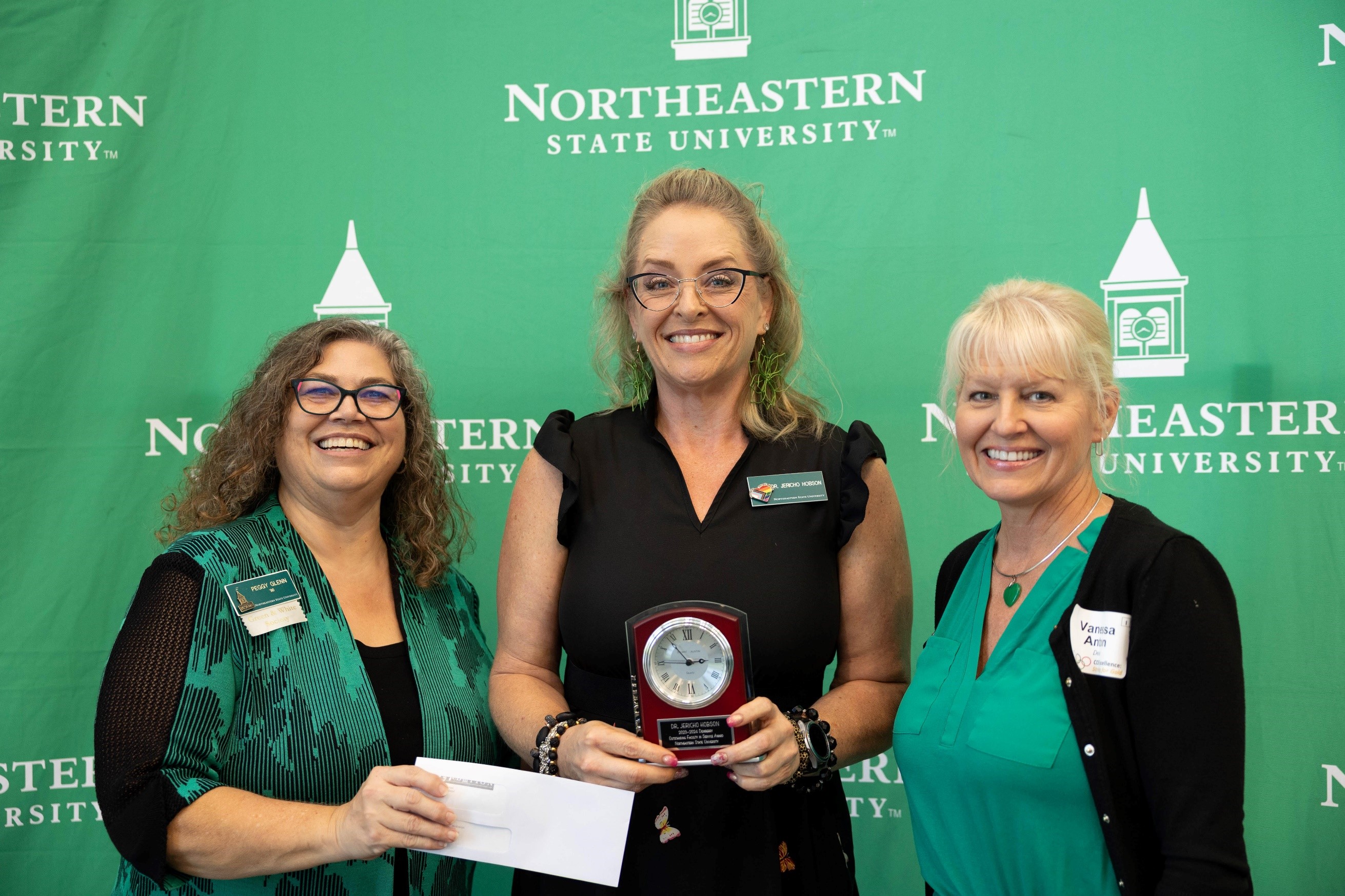 Dr. Jericho Hobson (center) receiving award