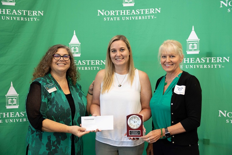 Dr. Amanda Stuckey (center) receiving award