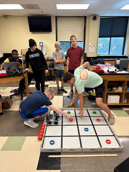 Student participants were testing their built robotic vehicles in the Summer Academy. Their task was to achieve “pizza delivery” using their vehicles.