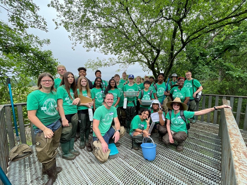 Drs. Pamela Christol and Nathan Green lead a team of middle school students on a field survey of bodies of water at the Mary K. Oxley Nature Preserve in Tulsa, OK.