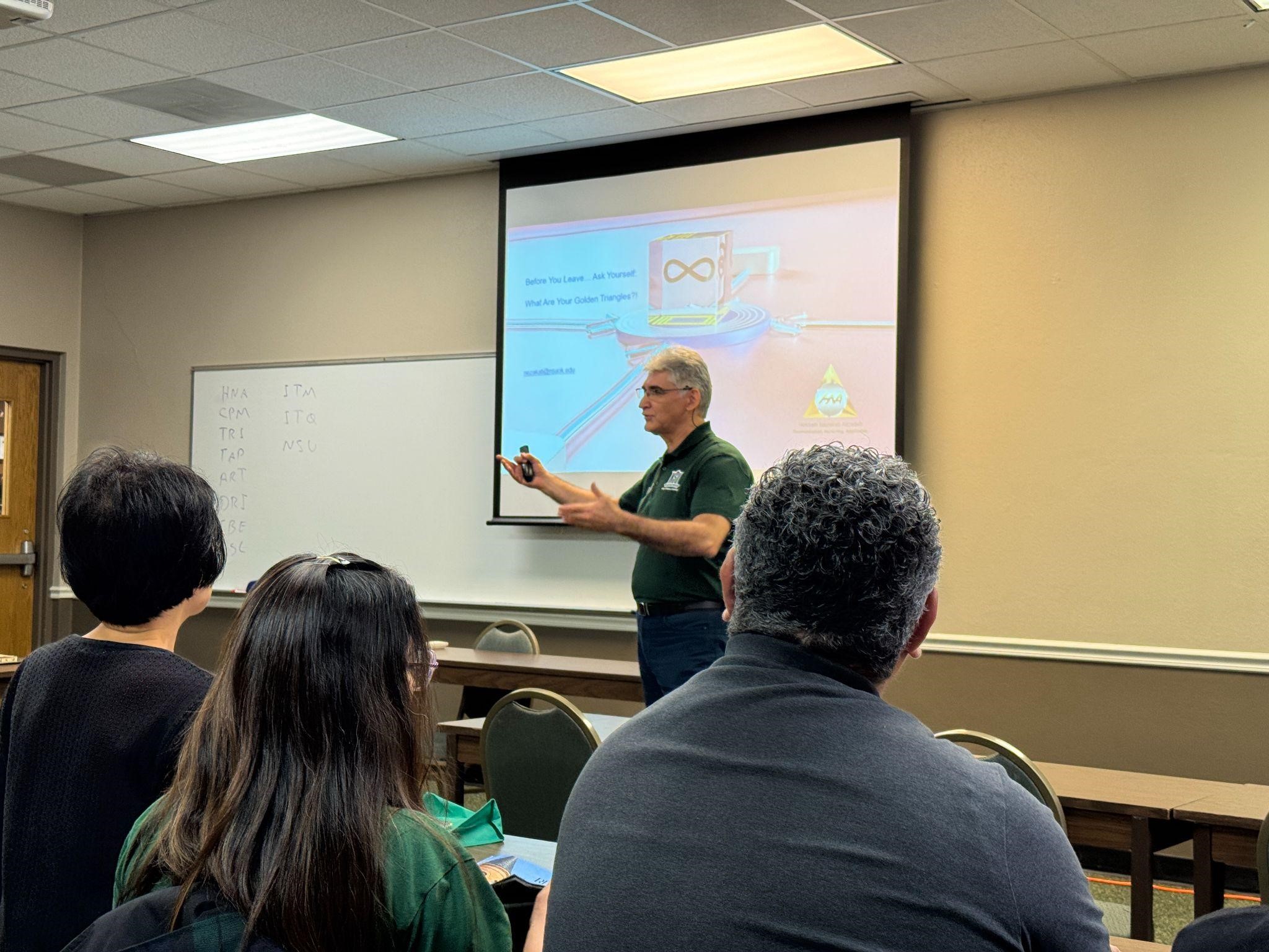 Dr. Hossein Nezakati presenting during conference