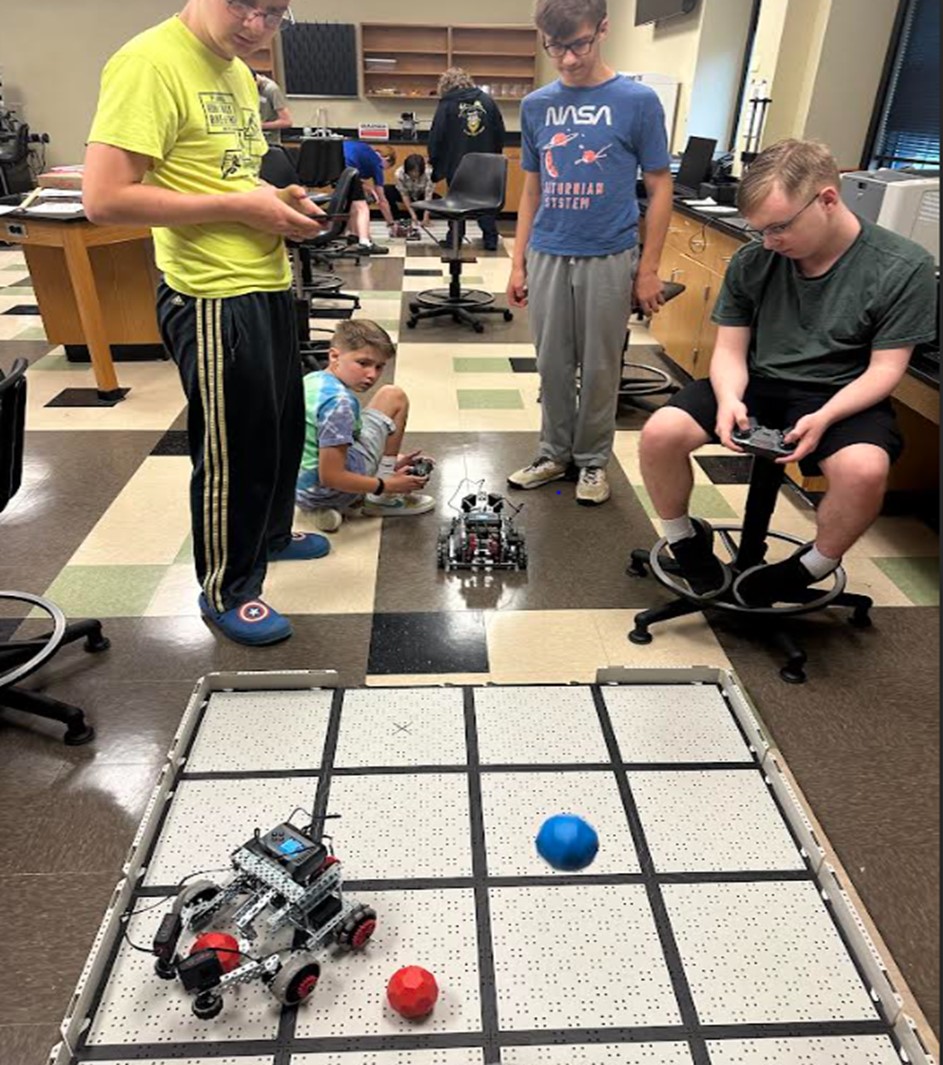 Students in the summer academy testing their robotic vehicles.