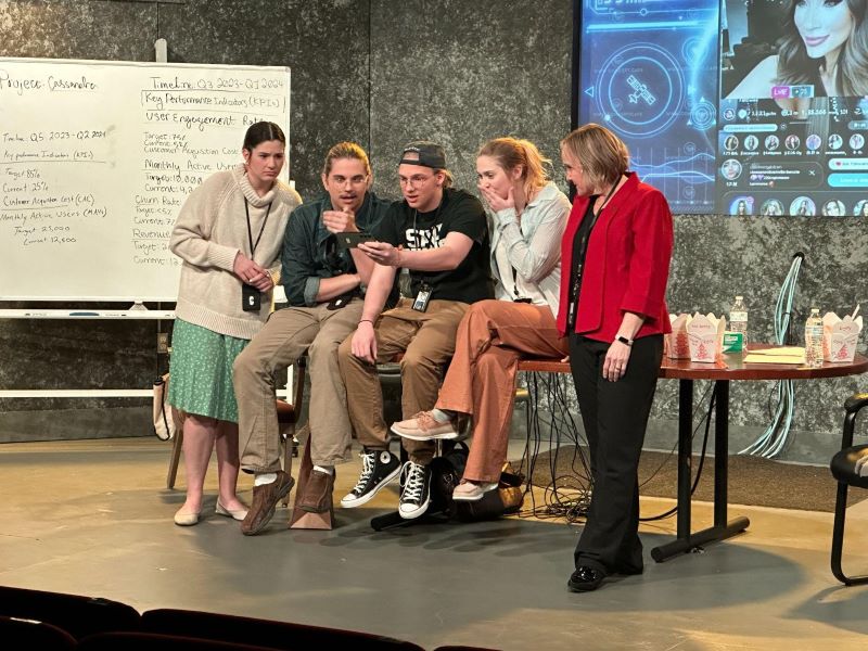 Drama students (from left to right) Jadyn McKelvey, Hunter Sunday, Seth Griffin, and Cooper Romo perform alongside faculty member Amber Margarit (far right).