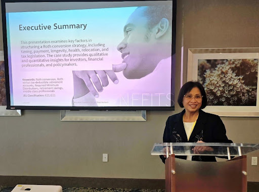 Dr. Kwok presenting her research on tax-efficient retirement planning.