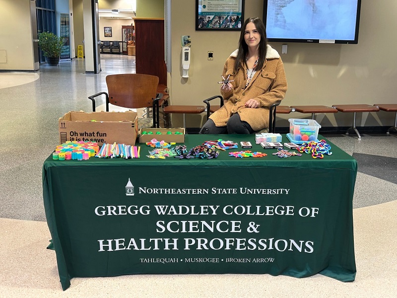 Dr. Cheyanne Olson passing out fidgets to students