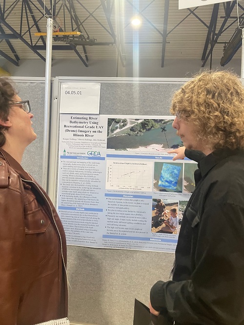 Keegan Stallings discussing his project with Dr. Deb Petrik during Oklahoma Research Day. Keegan is conducting research with Dr. Elizabeth Waring and is a recipient of the GRDA Fellowship for the 2023-2024 academic year.