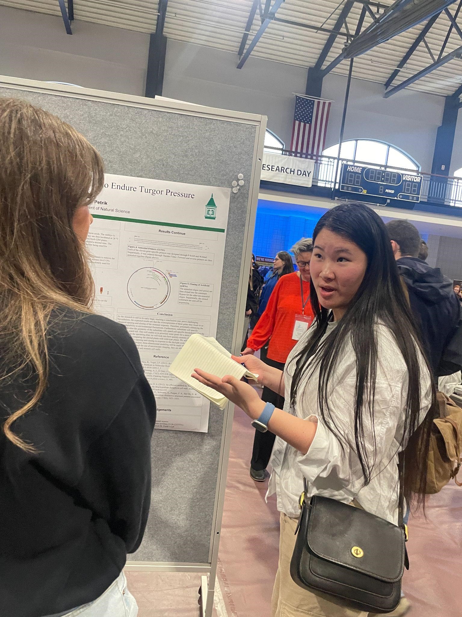 Qimeng Li presenting her poster at Oklahoma Research Day in Edmond OK on March 8, 2024.