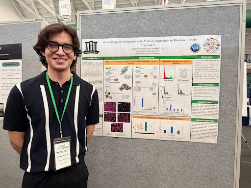 Alejandro Lopez his poster at Oklahoma Research Day