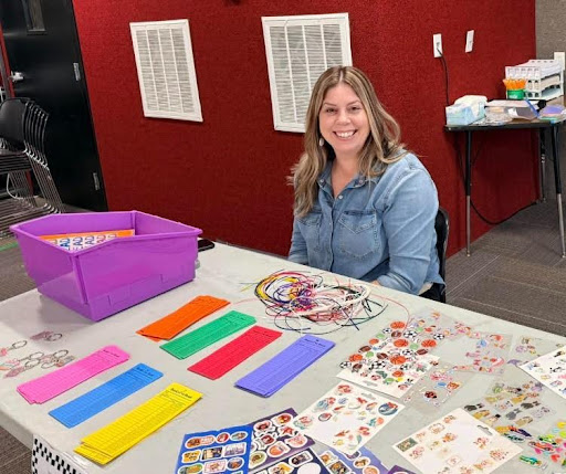 Renae Blossom mans the table at Briggs’ family literacy night