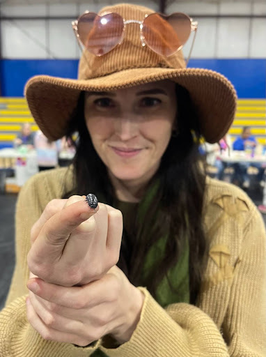 Dr. Cheyanne Olson (Biological Sciences) holding a pill bug.
