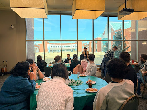 Faculty, staff, and students at the Meet, Mingle, and Make an Impact event at NSU-BA.