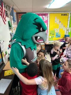 NSU mascot, Rowdy, with children in the classroom. 