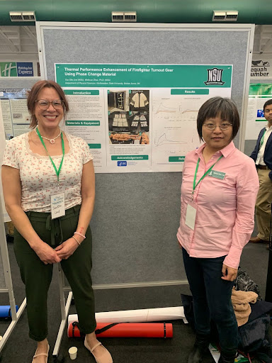 Sue Lind (left) with her poster and Dr. Weihuan Zhao (right)