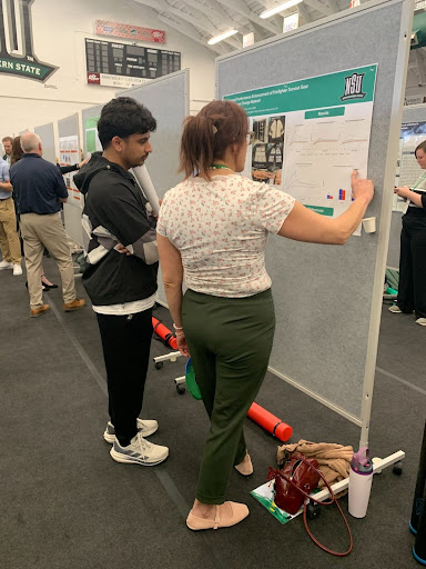 Sue Lind (right) presenting her research to student audience
