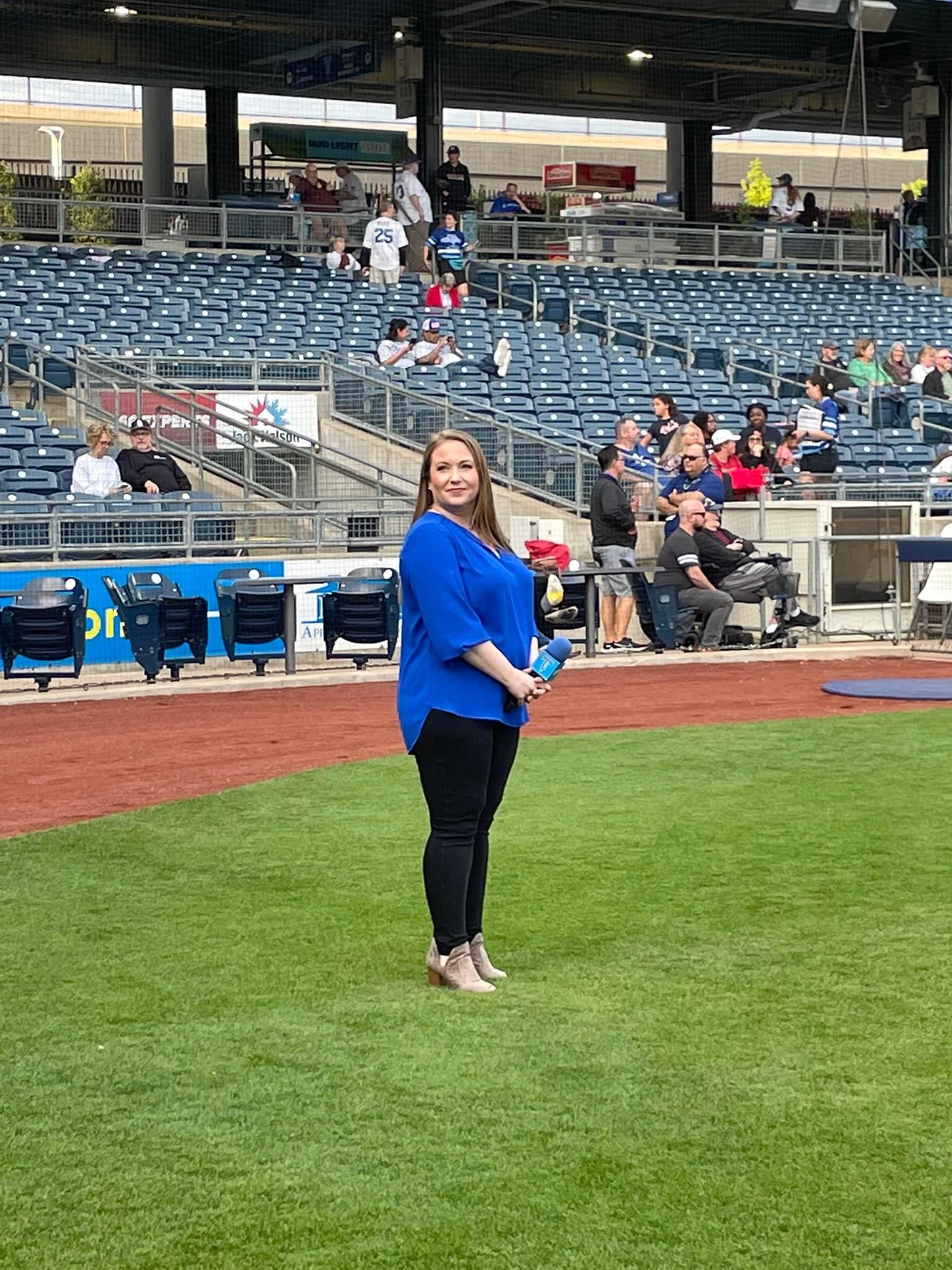 Dr. Whitney Myers on field at the Tulsa Drillers game.
