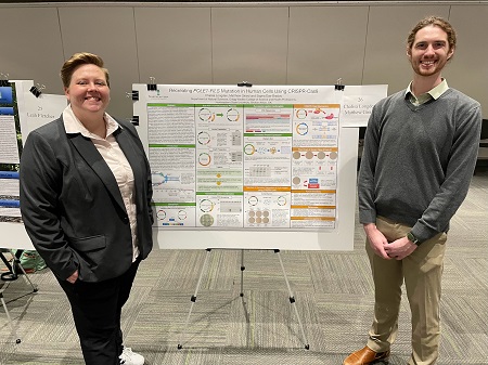 Lisa Longden and Matt Girard presenting their research poster at the URD