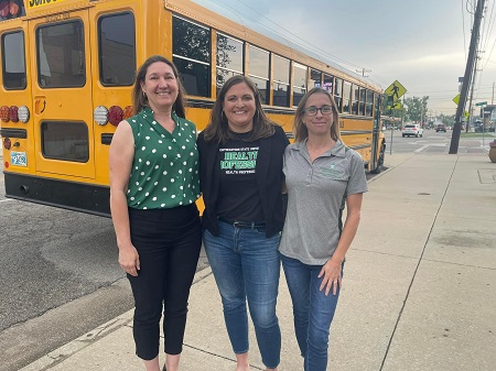 Dr. Martin, Dr. Dorrough, and Dr. Fuller at the Stuff the Bus event.