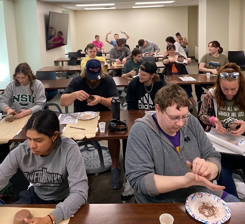 Students working with clay in class 