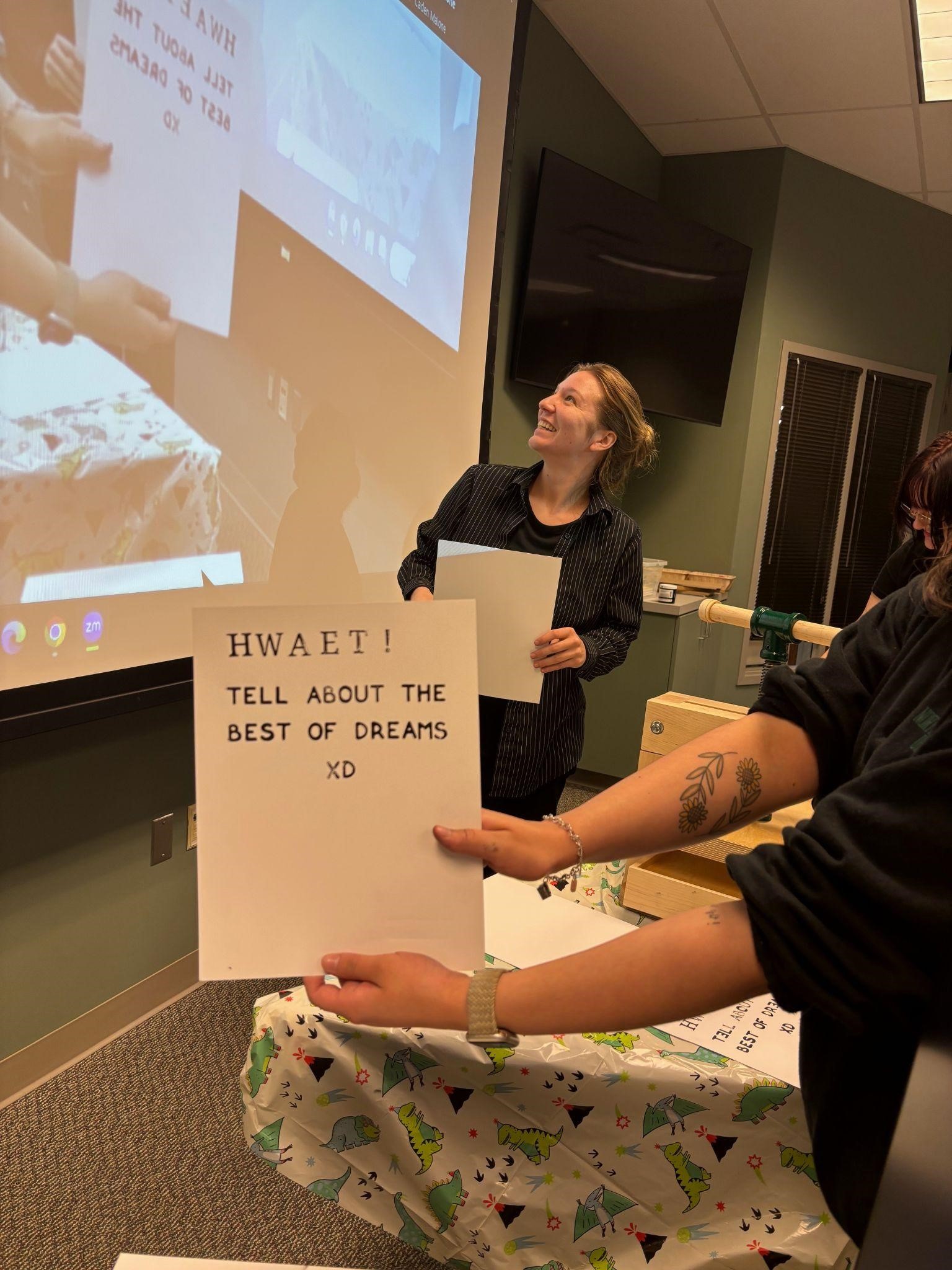 Glennis Cornwell is pictured, as Janine Wagdalt holds up their group's printing of a portion of Beowulf. Glennis Cornwell is pictured, as Janine Wagdalt holds up their group's printing of a portion of Beowulf.