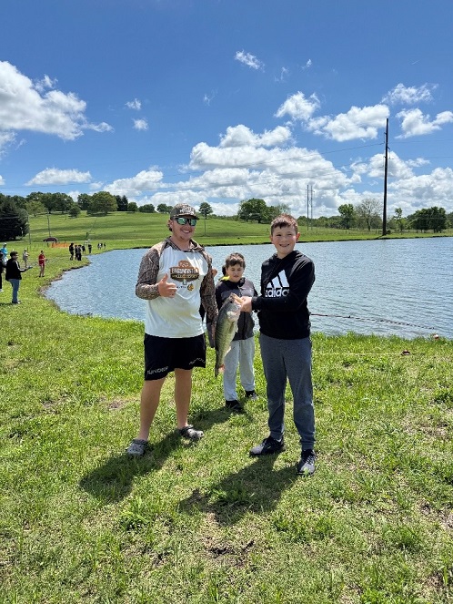 Students holding fish