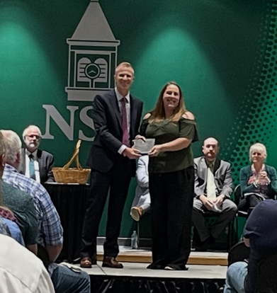 Katherine Nehmzow Katherine Nehmzow receiving award from Graduate Dean, Dr. Iain Anderson