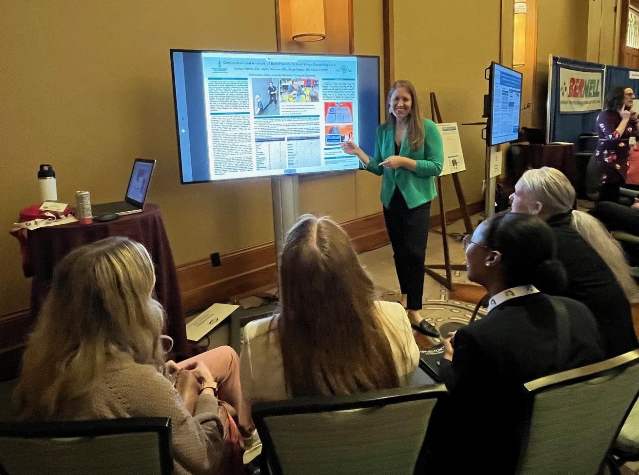 Dr. Alissa Proctor presenting her research poster at the OVDRA meeting.