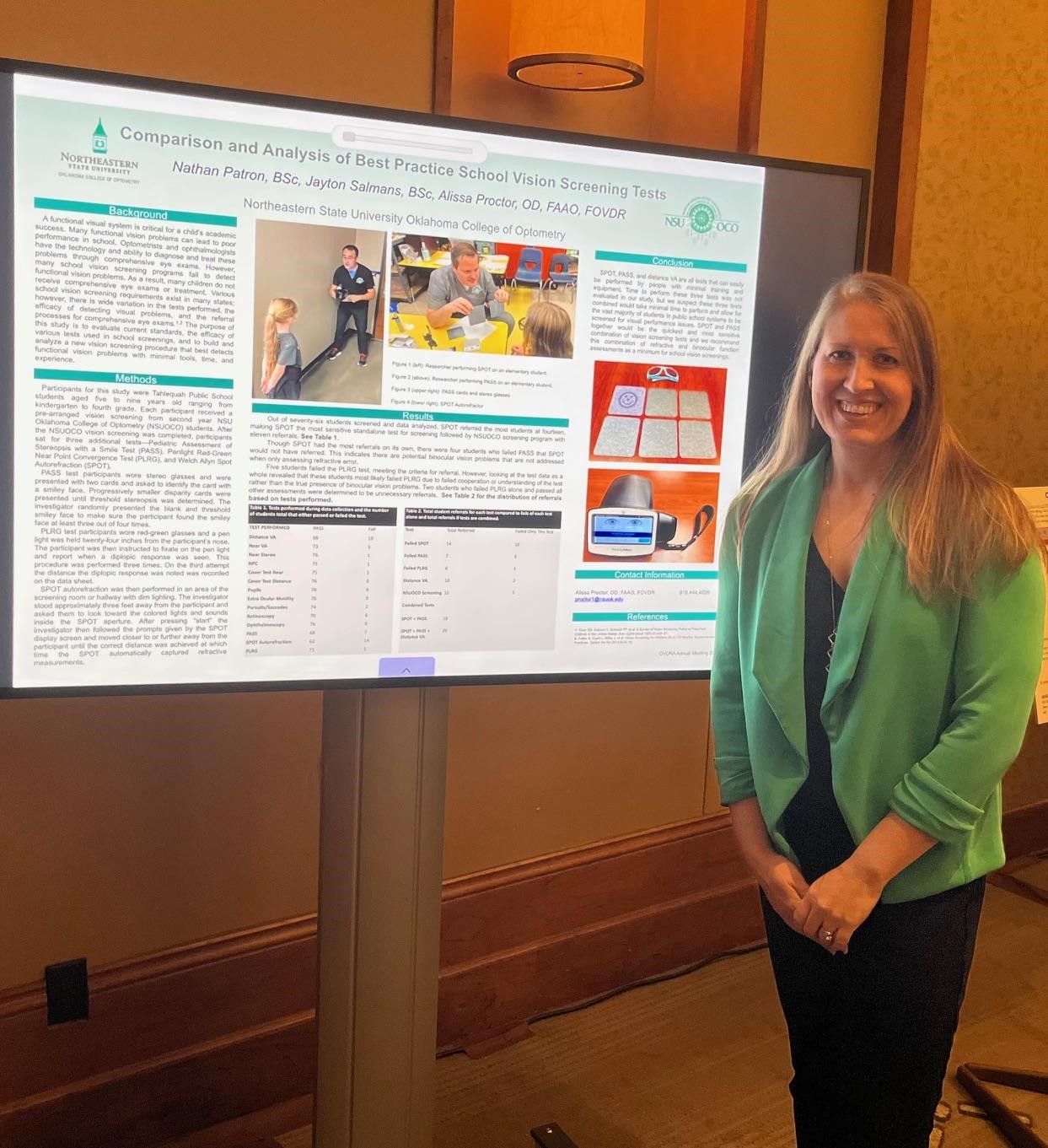 Dr. Alissa Proctor presenting her research poster at the OVDRA meeting.