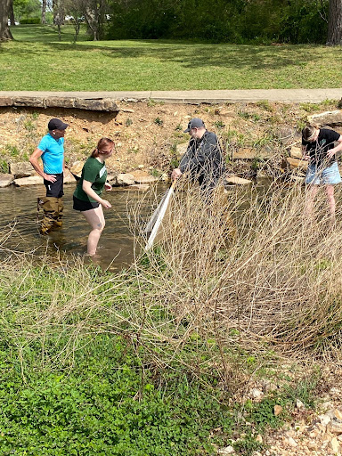 Students working with Nation Environmental Programs scientists in the Town Branch creek