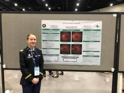 Dr. Erin Downing presenting her poster at the American Academy of Optometry 2022.