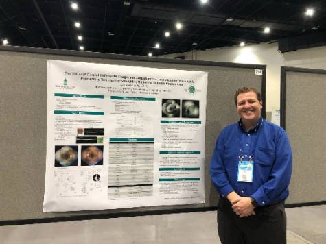 Dr. Matthew Bills presenting his poster at the American Academy of Optometry 2022.