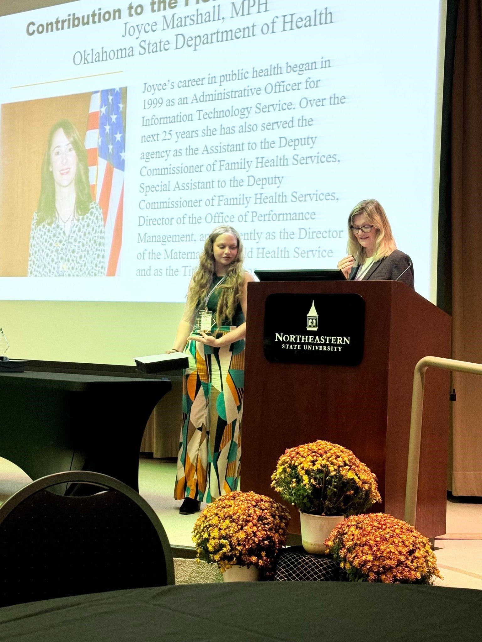 Dr. Doyle and Kent presenting at the awards.