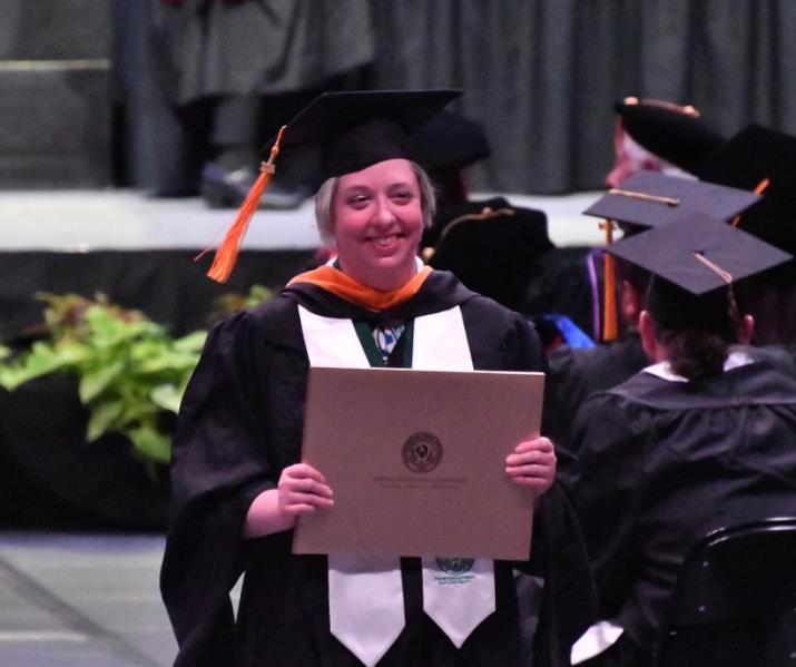 Lydia Ostmo with her Masters in Natural Sciences degree. 