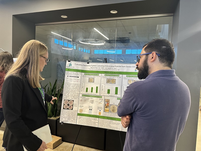 Rachel Fox presenting her poster at the OAS Annual Technical Meeting