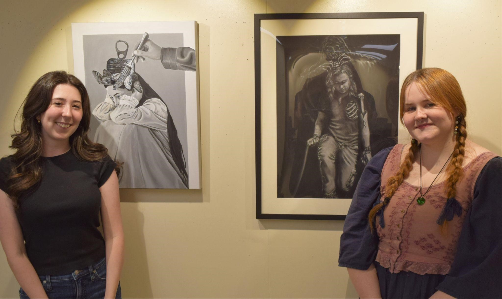 Whitley Moore (left) and Winter Lisenbee with their award-winning art.