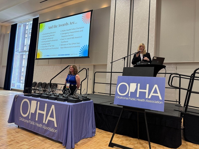 Kent (left) and Doyle (right) presenting awards at the OPHA conference